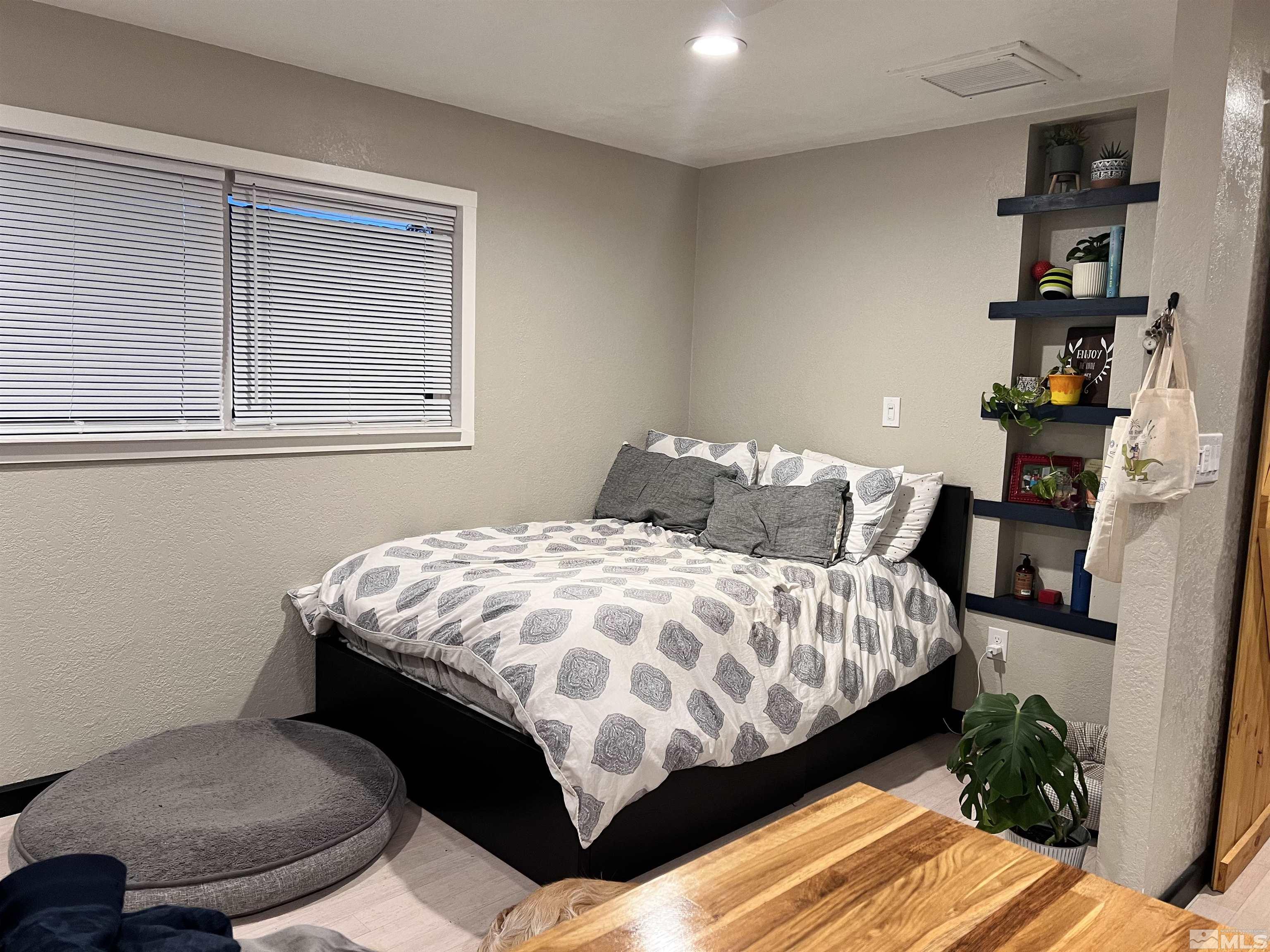 840 Bates Avenue Reno, NV 89502 - Photo 32 of 39 a bedroom with a bed and a potted plant