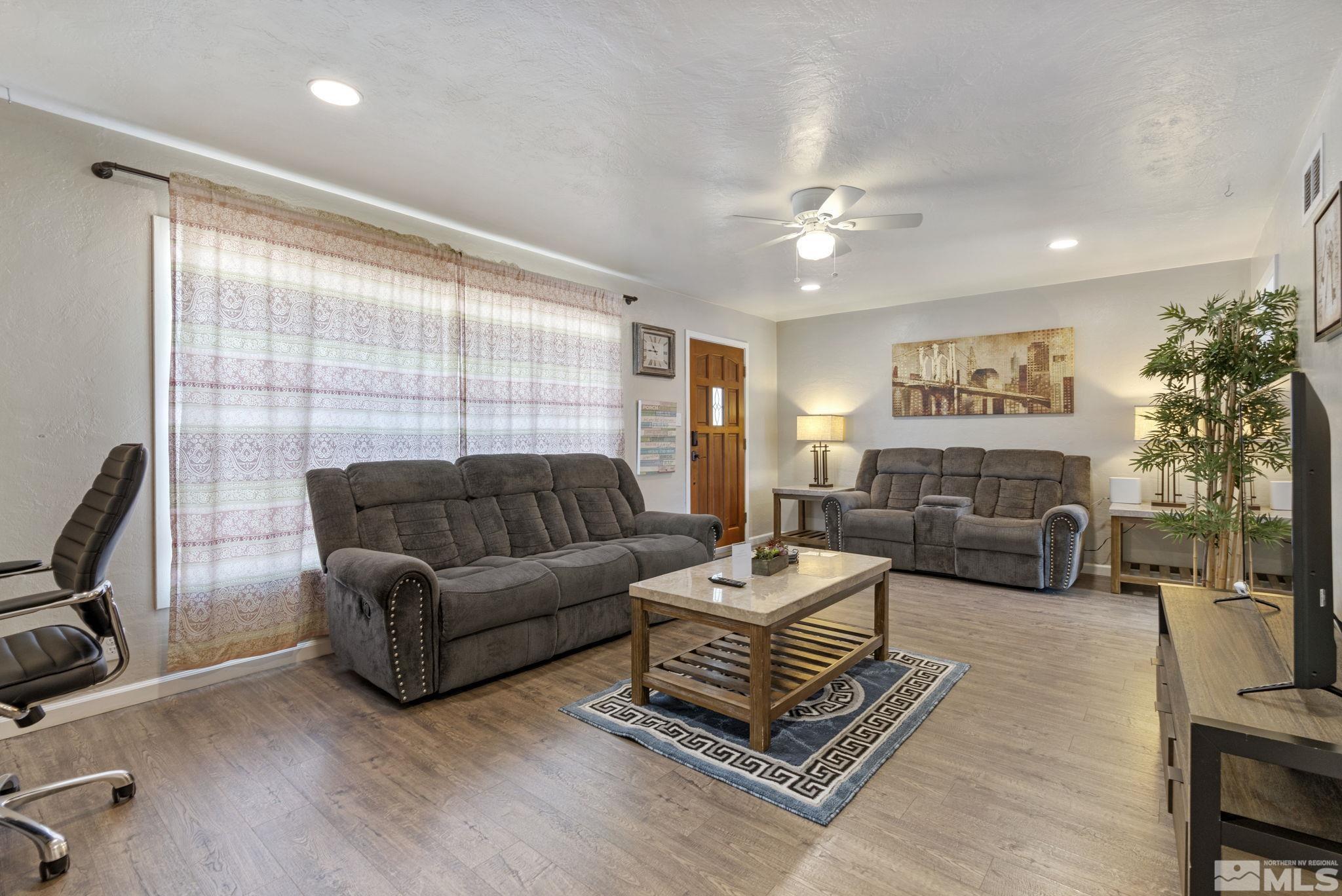 840 Bates Avenue Reno, NV 89502 - Photo 5 of 39 a living room with furniture ceiling fan and a window