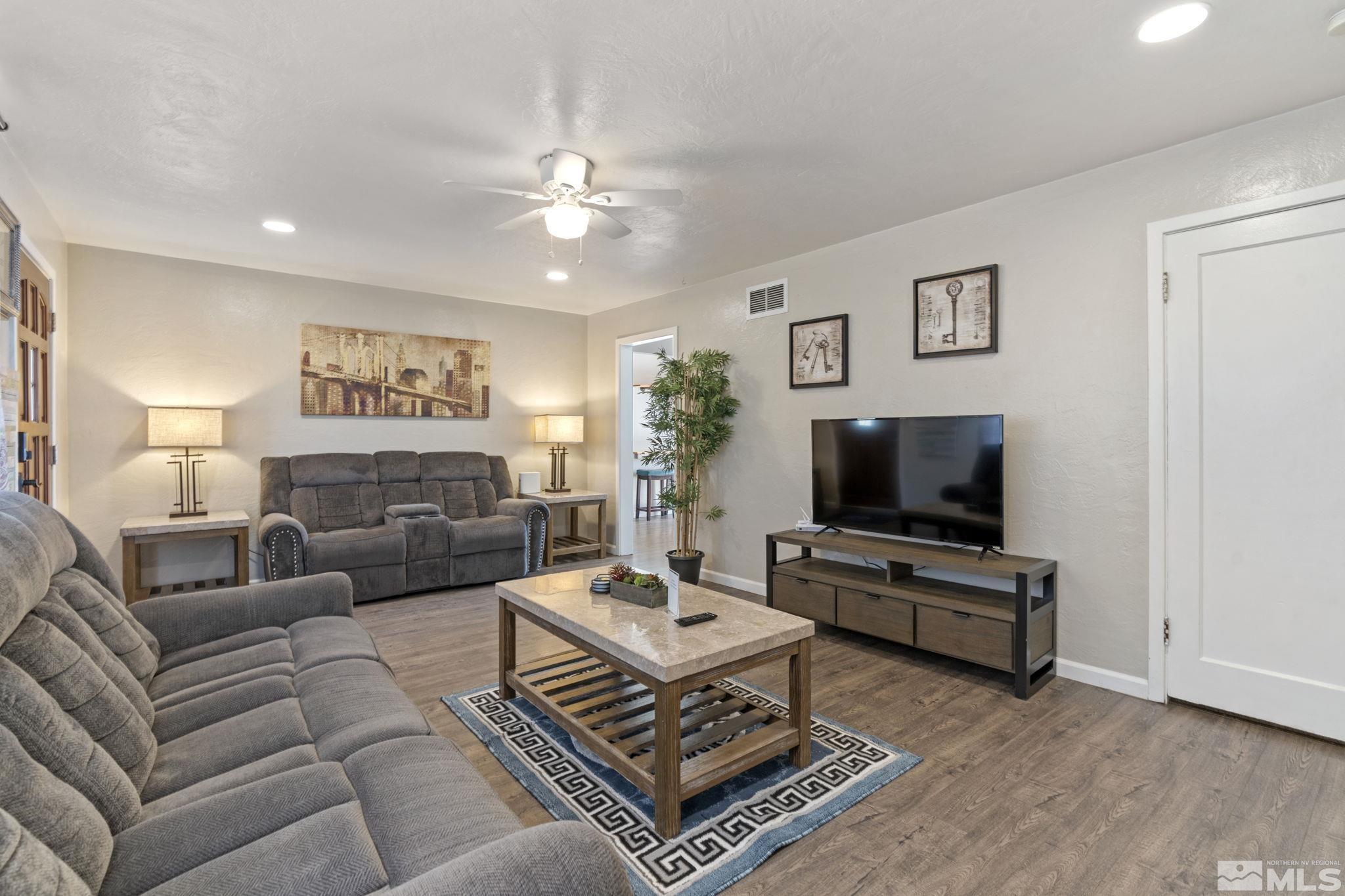 840 Bates Avenue Reno, NV 89502 - Photo 6 of 39 a living room with furniture and a flat screen tv