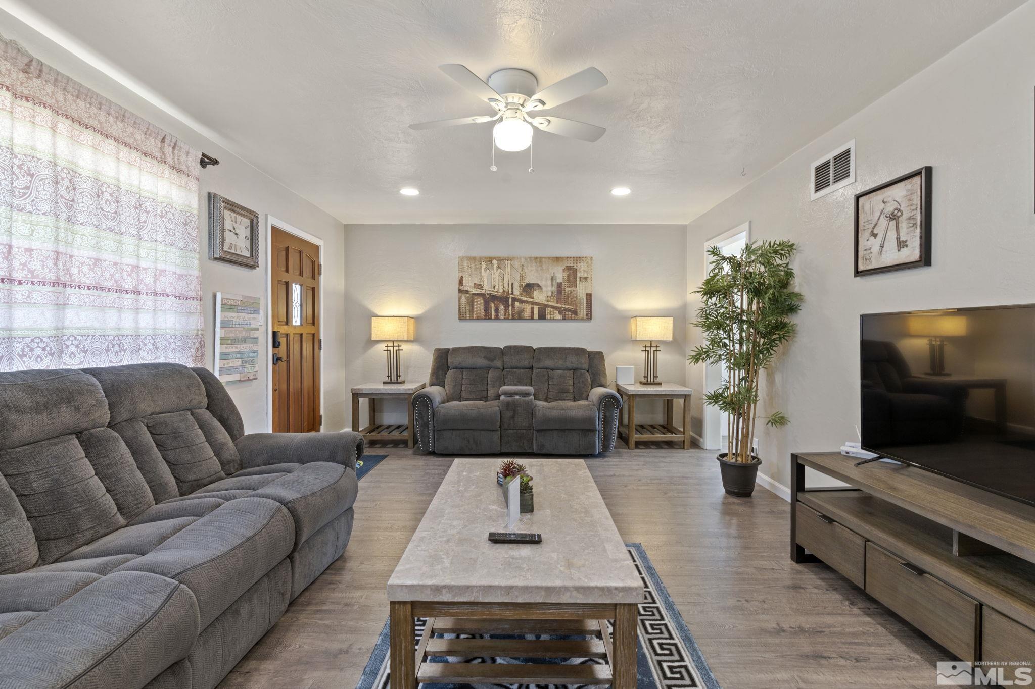 840 Bates Avenue Reno, NV 89502 - Photo 7 of 39 a living room with furniture and a flat screen tv