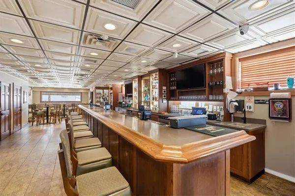 a living room with lots of furniture and a flat screen tv