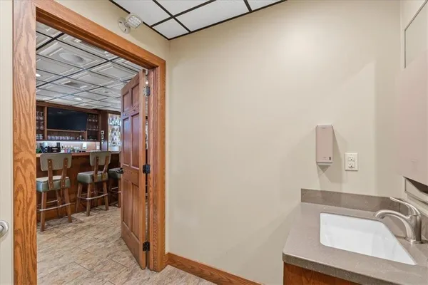 a bathroom with a sink and a mirror