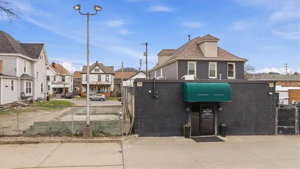 a view of a patio with a table and chairs