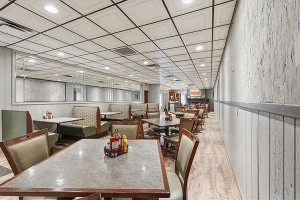 a view of a livingroom with furniture and a fireplace