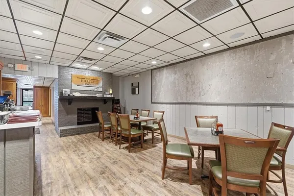 a view of a dining room with furniture and window