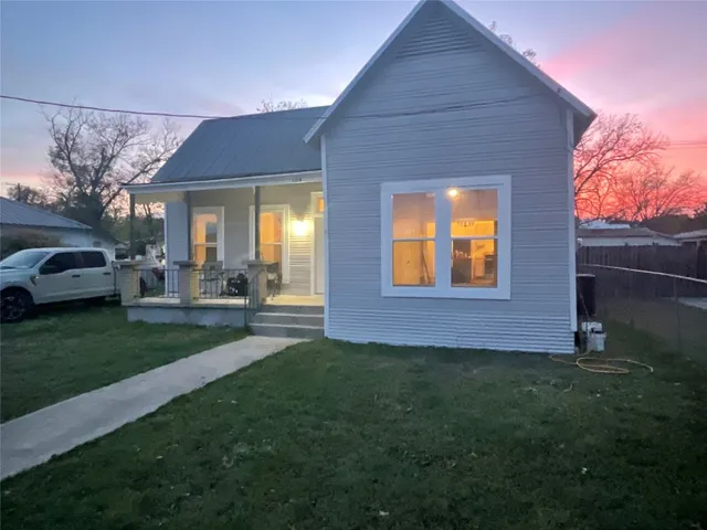a view of a house with a garden