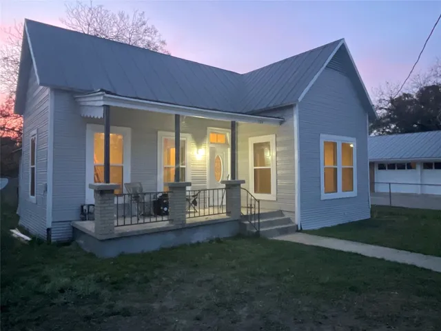 a house view with a garden space