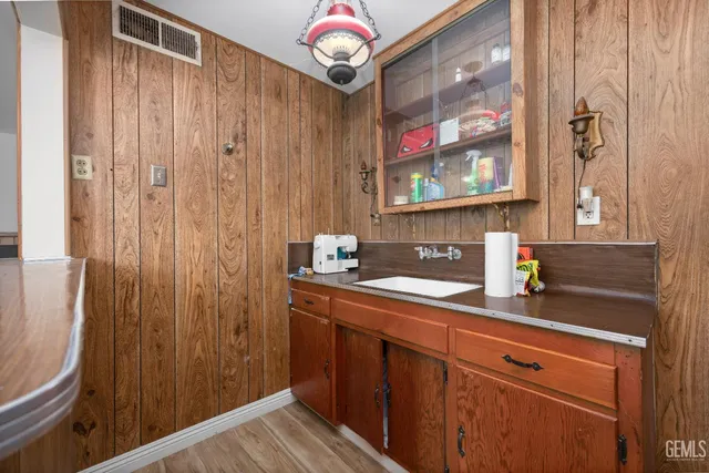 a kitchen with a sink and cabinets