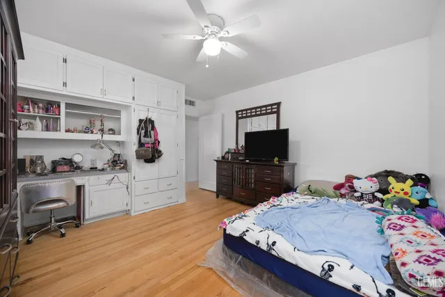 a bed room with a bed and a tv