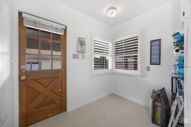 a kitchen with granite countertop a sink and a stove top oven