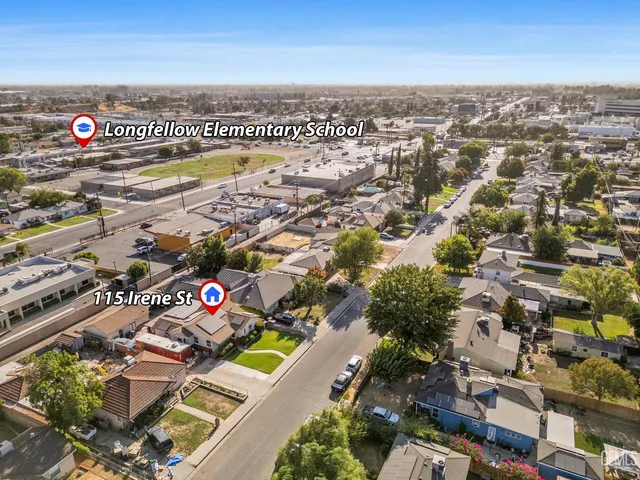 an aerial view of multiple house with parking