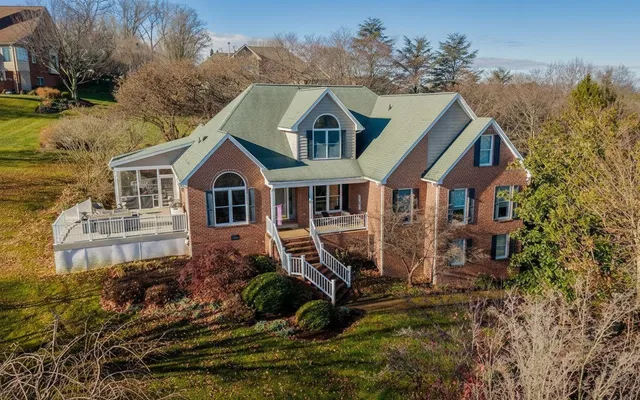a aerial view of a house with a yard
