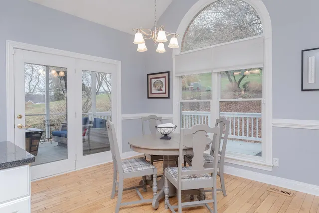 a living room with a fireplace and a flat screen tv
