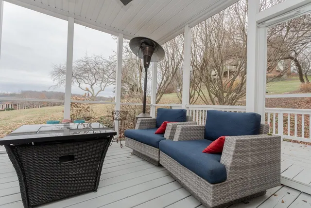 a bathroom with a granite countertop toilet sink and mirror