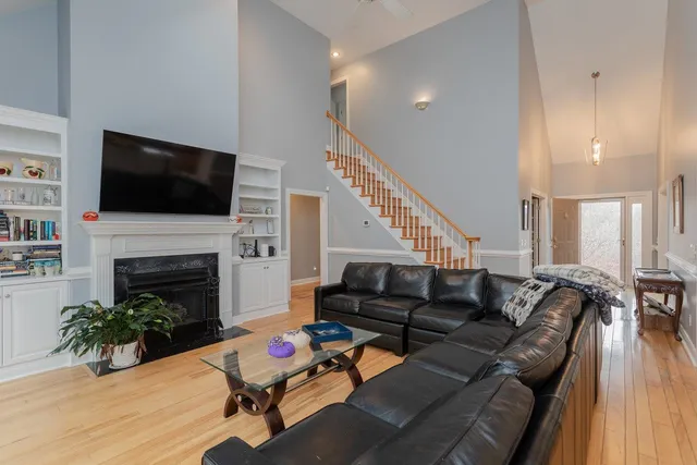 a bathroom with a granite countertop sink a mirror and a shower
