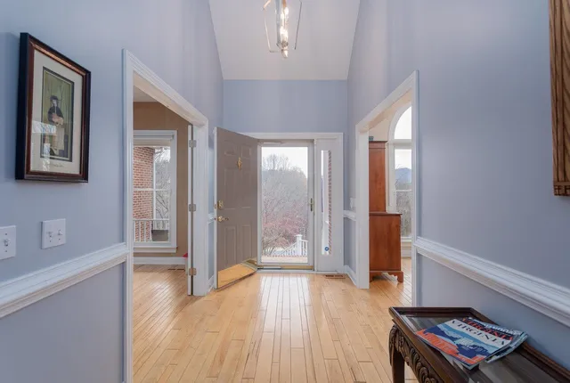 a view of room with window and wooden floor