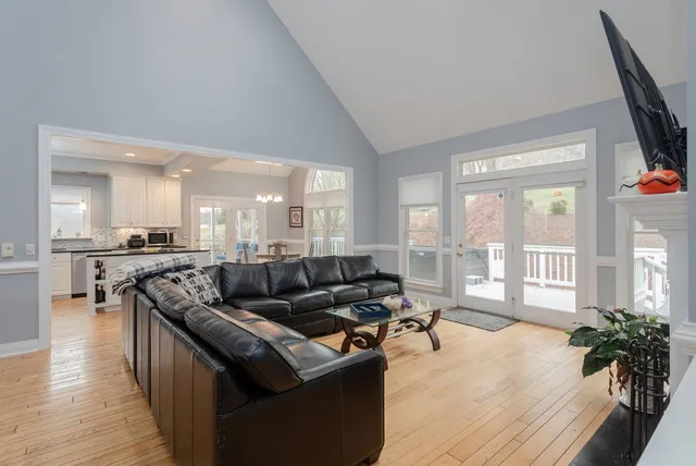 a bathroom with a granite countertop sink a toilet and bathtub