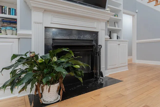 a bathroom with a granite countertop tub a sink and a window