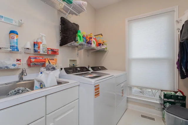 a bathroom with a sink vanity and a mirror