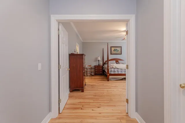 a bedroom with a bed and a mirror