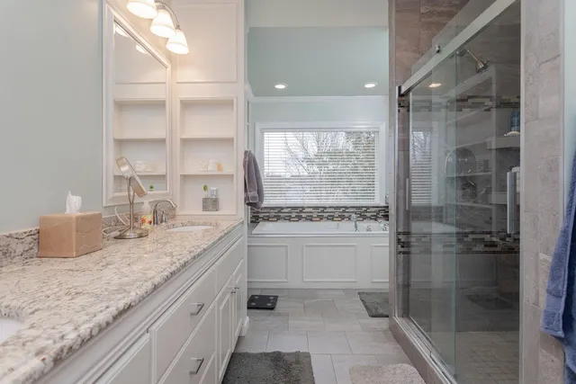 a view of a livingroom with wooden floor and a window