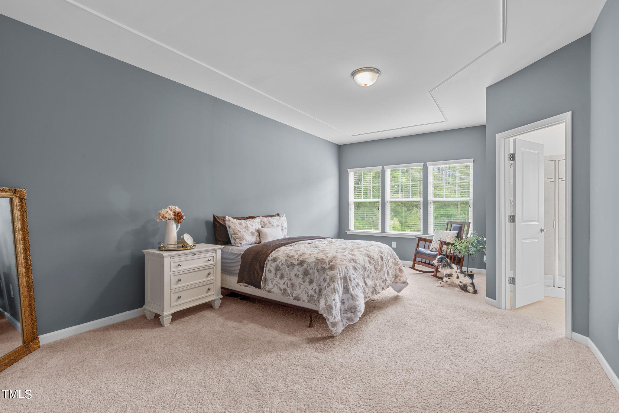 624 Edgewater Ridge Court Apex, NC 27523 - Photo 29 of 38 Primary suite with lush, green views of the wooded back yard.
