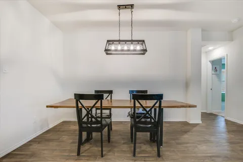 a view of kitchen with furniture and wooden floor