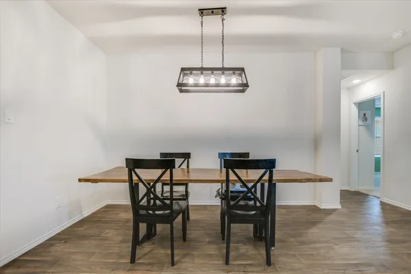 a view of kitchen with furniture and wooden floor