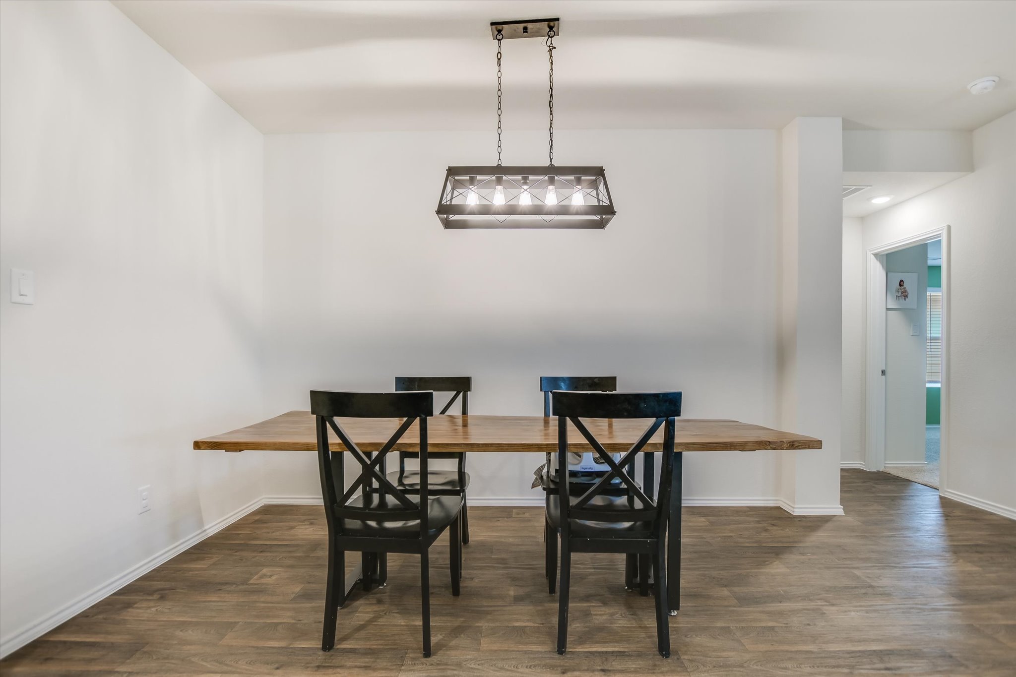 262 Sickle Loop Kyle, TX 78640 - Photo 3 of 20 Dining room with dark wood finished floors