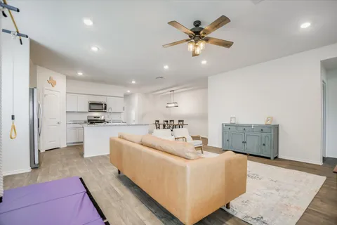 a view of a dining room with furniture and wooden floor
