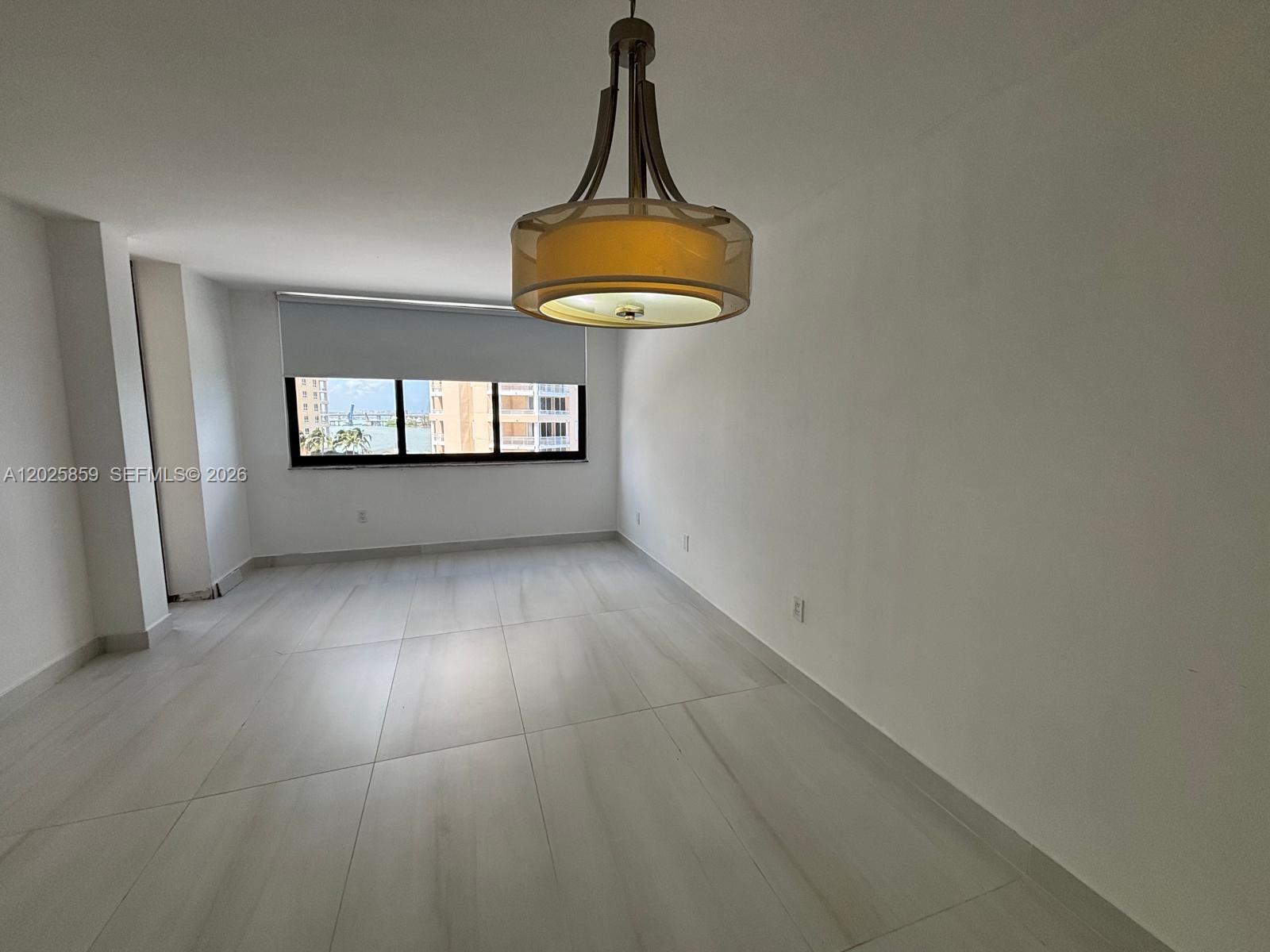 540 Brickell Key Drive, Unit 1024 Miami, FL 33131 - Photo 15 of 28 a view of wooden floor and window in a room