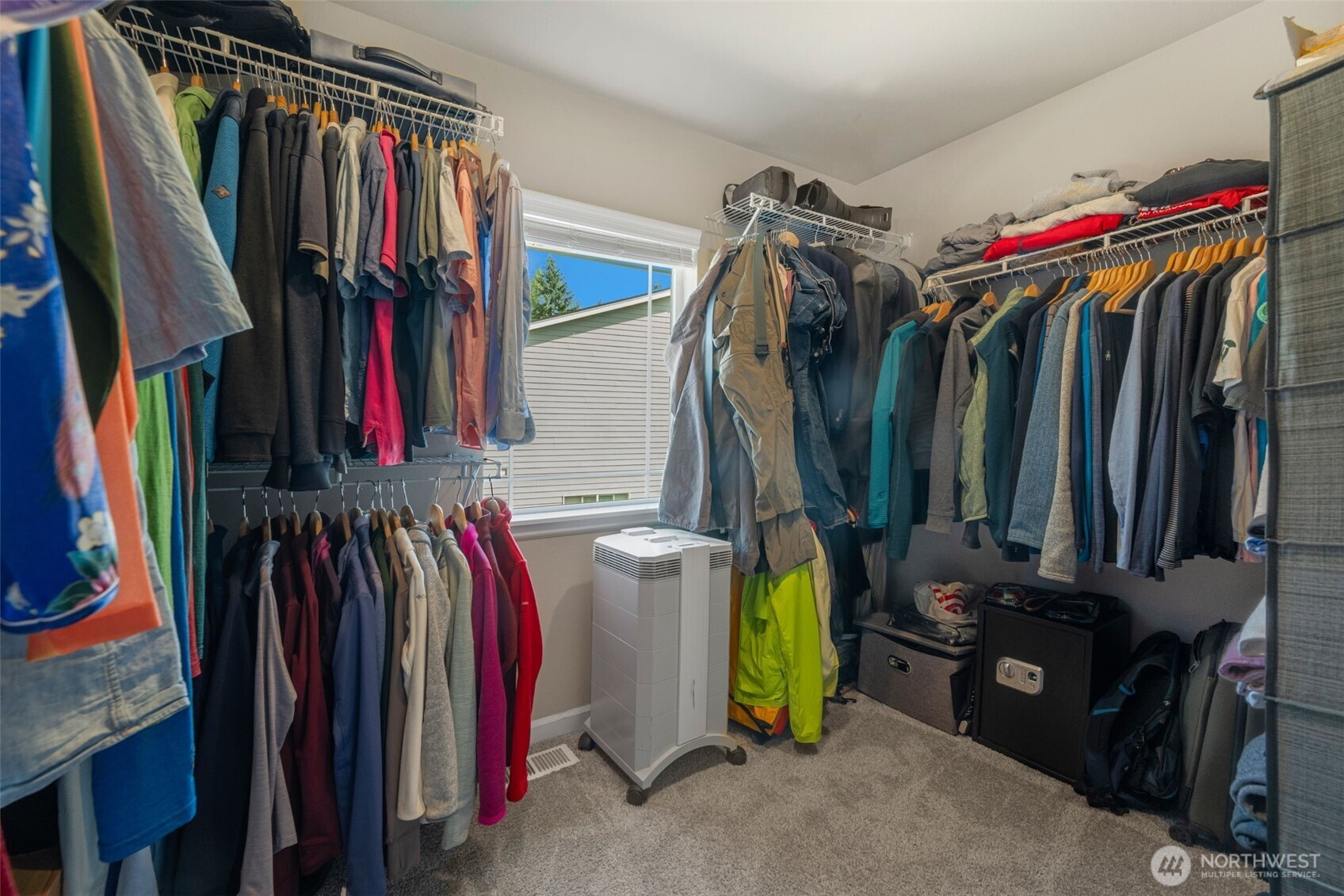 216 178th Street Southeast Bothell, WA 98012 - Photo 29 of 40 a view of walk in closet with clothes and shoes