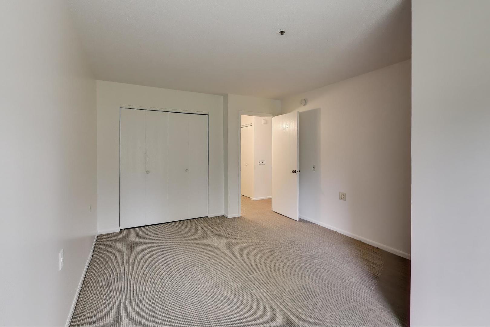 800 Ridge Road, Unit 114 Wilmette, IL 60091 - Photo 16 of 23 a view of an empty room and wooden floor