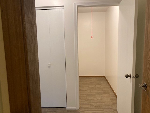 800 Ridge Road, Unit 114 Wilmette, IL 60091 - Photo 19 of 23 a view of a hallway with wooden floor
