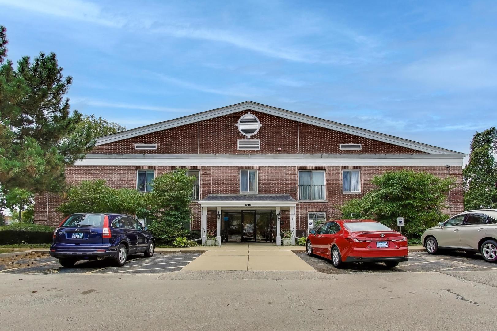 800 Ridge Road, Unit 114 Wilmette, IL 60091 - Photo 3 of 23 a car parked in front of a house