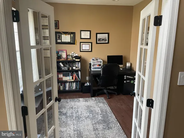 a view of a workspace with furniture