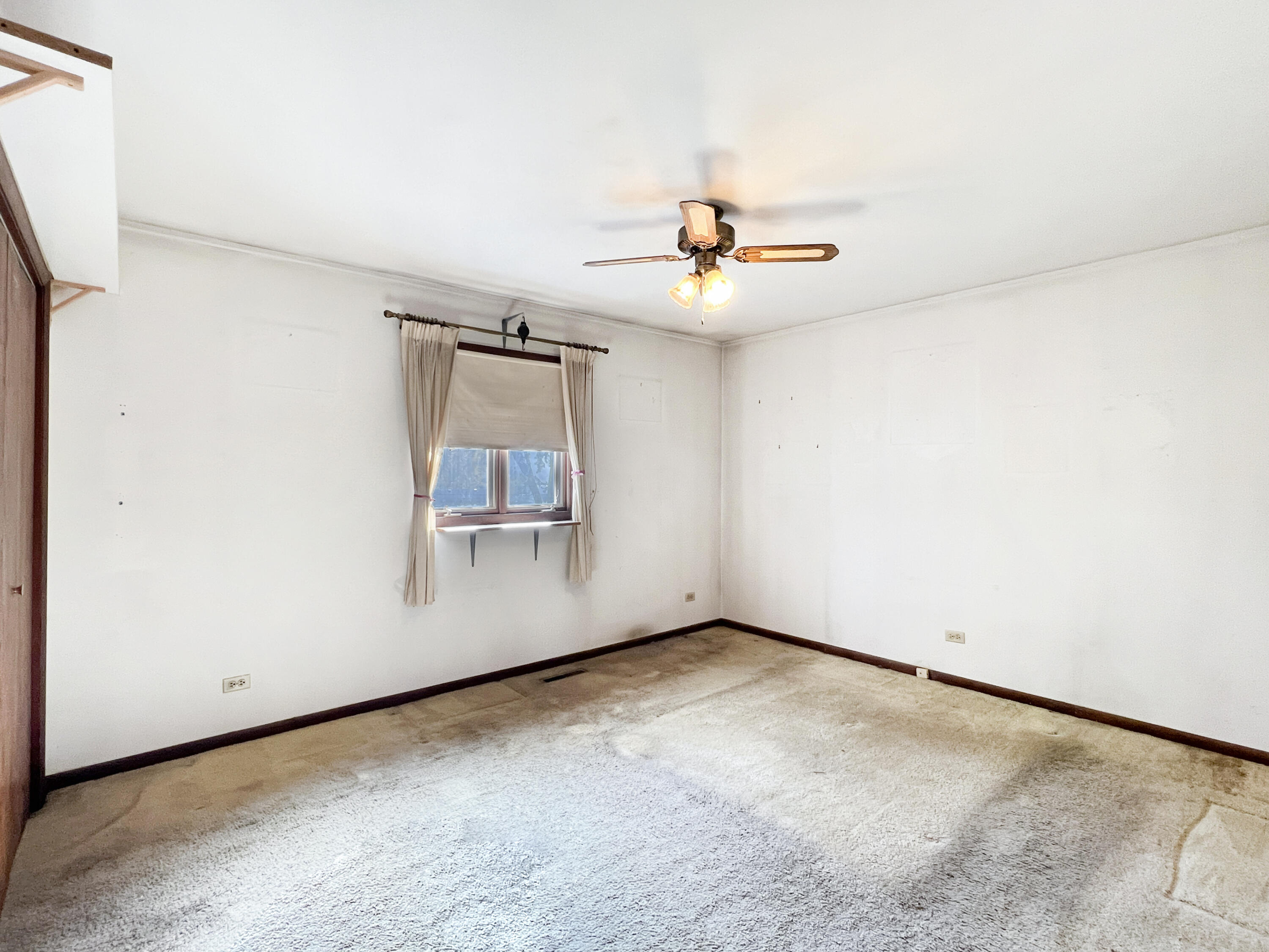 7431 West 83rd Lane Crown Point, IN 46307 - Photo 8 of 13 an empty room with windows and couch