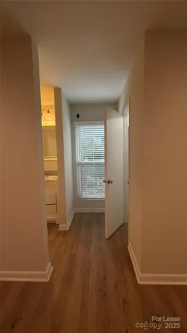 an empty room with a empty space and windows