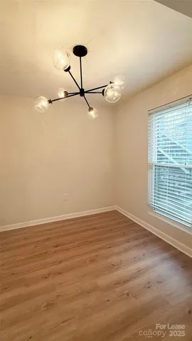 a kitchen with stainless steel appliances granite countertop a sink a stove a refrigerator and cabinets