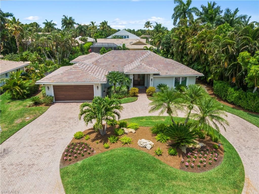 521 Turtle Hatch Road Naples, FL 34103 - Photo 2 of 34 an aerial view of a house with garden space and a patio