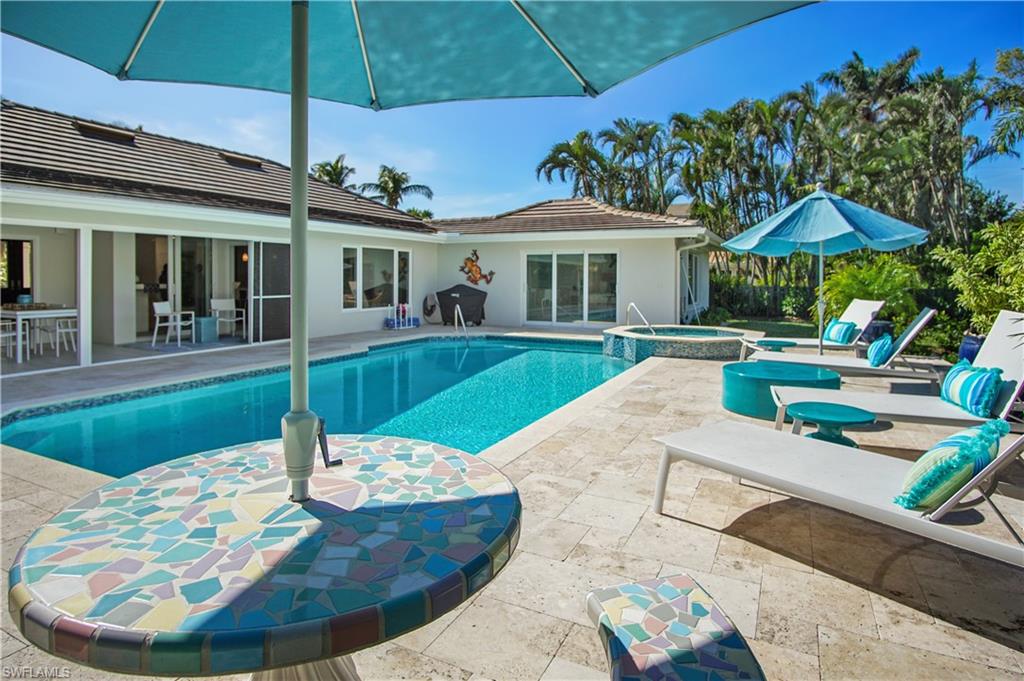 521 Turtle Hatch Road Naples, FL 34103 - Photo 27 of 34 swimming pool view with a seating space