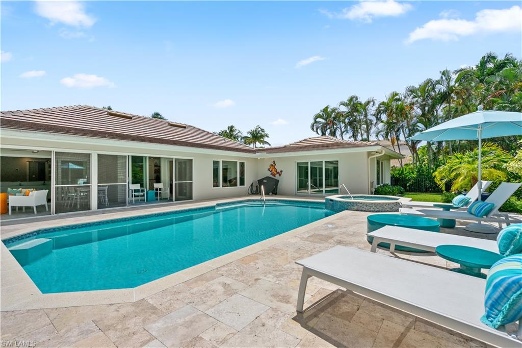 521 Turtle Hatch Road Naples, FL 34103 - Photo 29 of 34 a view of house with swimming pool outdoor seating