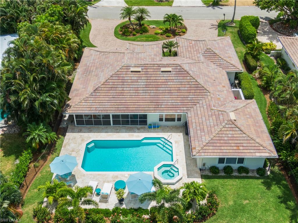 521 Turtle Hatch Road Naples, FL 34103 - Photo 31 of 34 a view of a house with a yard and plants