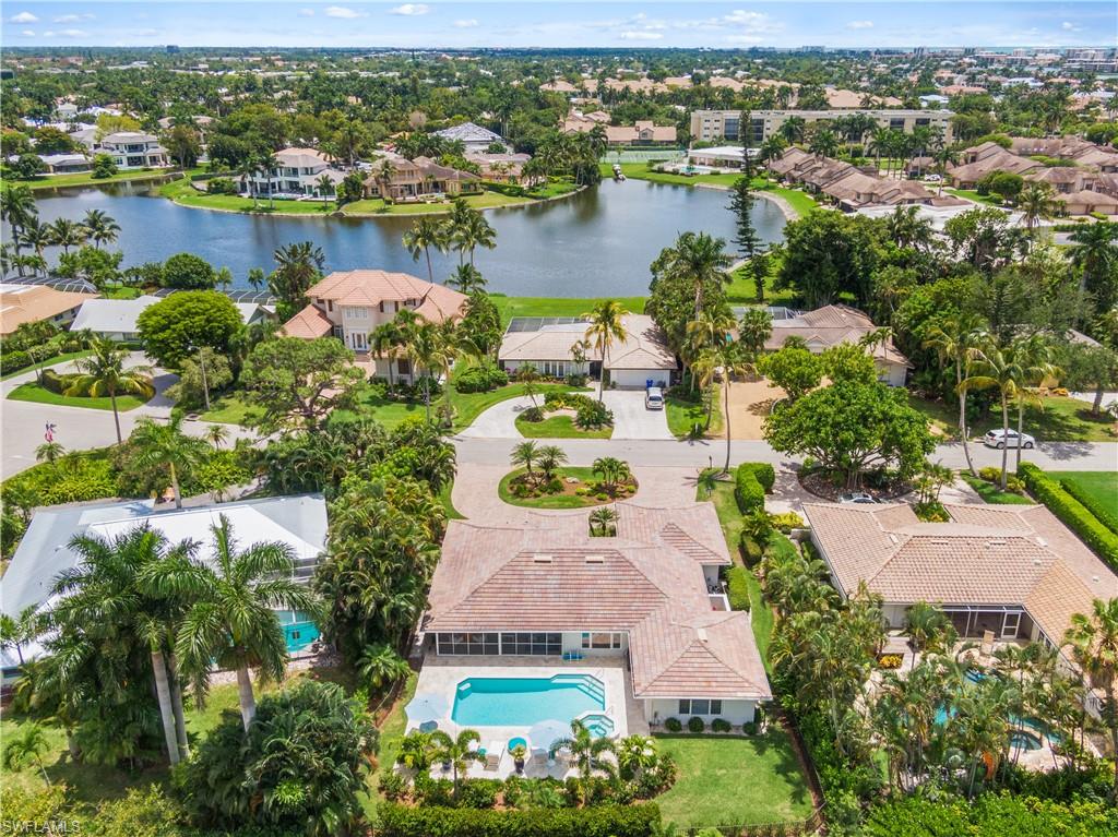 521 Turtle Hatch Road Naples, FL 34103 - Photo 32 of 34 an aerial view of a house with a lake view