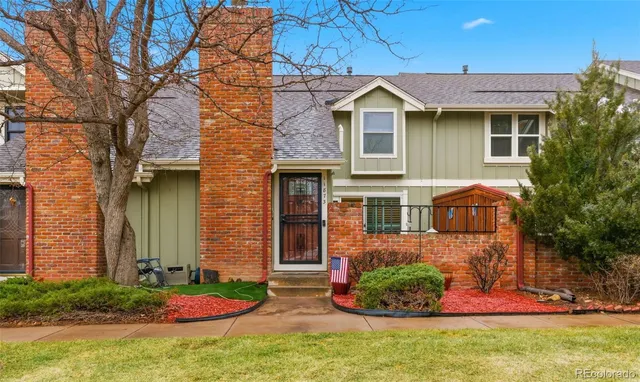 a view of a patio with table and chairs and potted plants