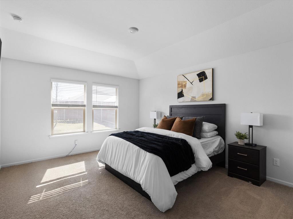 401 Attalla Street Azle, TX 76020 - Photo 12 of 24 a spacious bedroom with a bed and a window
