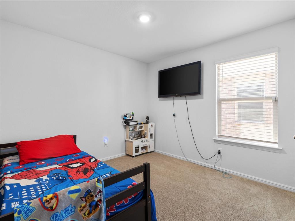 401 Attalla Street Azle, TX 76020 - Photo 18 of 24 a living room with furniture and a flat screen tv