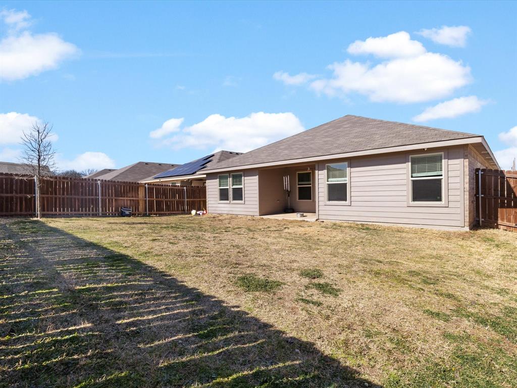 401 Attalla Street Azle, TX 76020 - Photo 21 of 24 a front view of a house with a yard