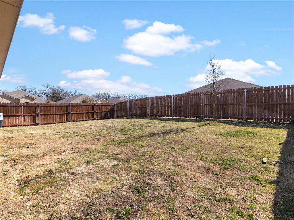 401 Attalla Street Azle, TX 76020 - Photo 22 of 24 a view of a backyard