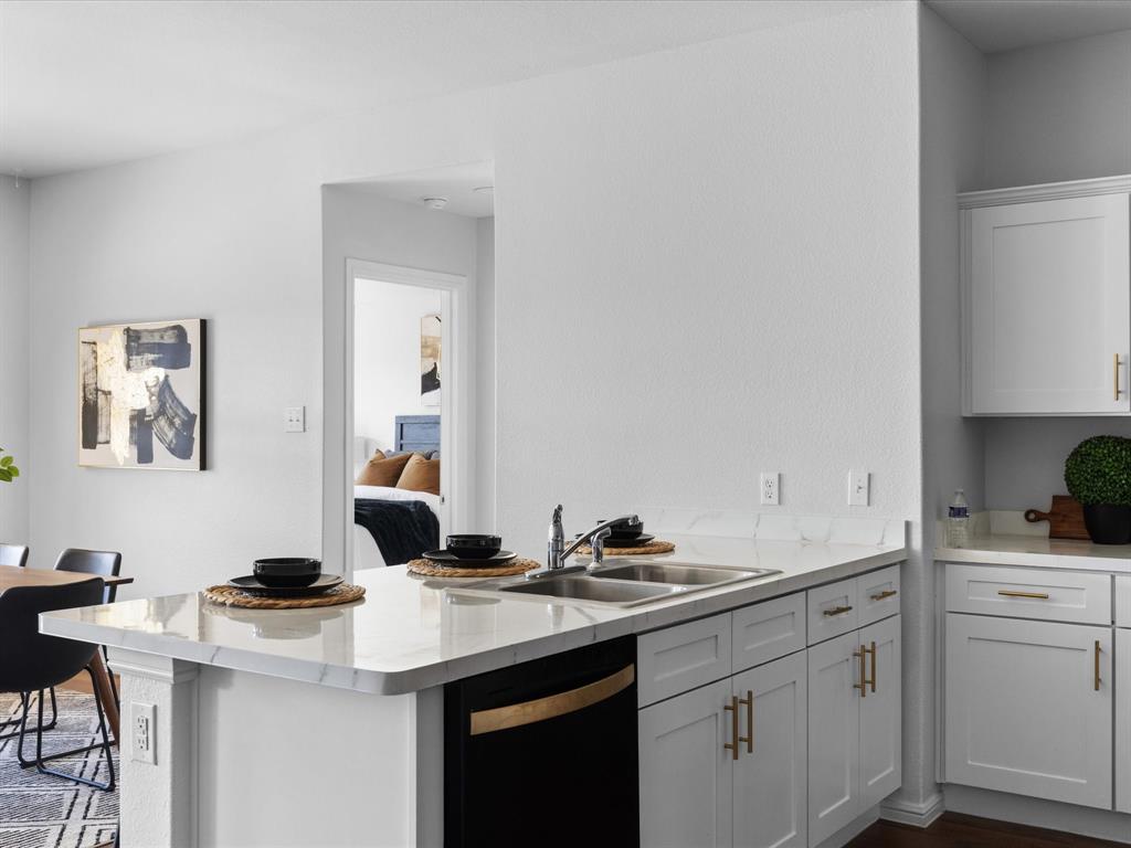 401 Attalla Street Azle, TX 76020 - Photo 4 of 24 a kitchen with a sink and cabinets